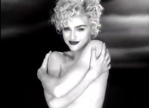 Madonna sans bra but lurking her globes
